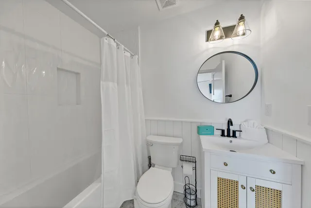 a kitchen with kitchen island granite countertop lots of counter top space and cabinets
