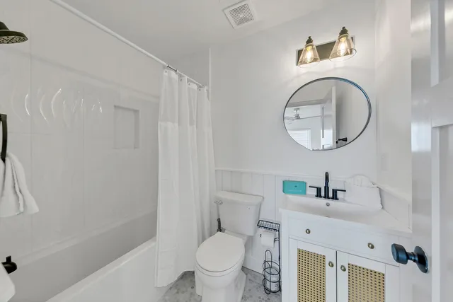 a roof deck with a table and chairs