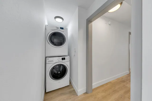 a bedroom with a bed and cabinet