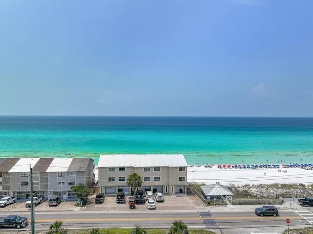 an aerial view of a house with a lake view