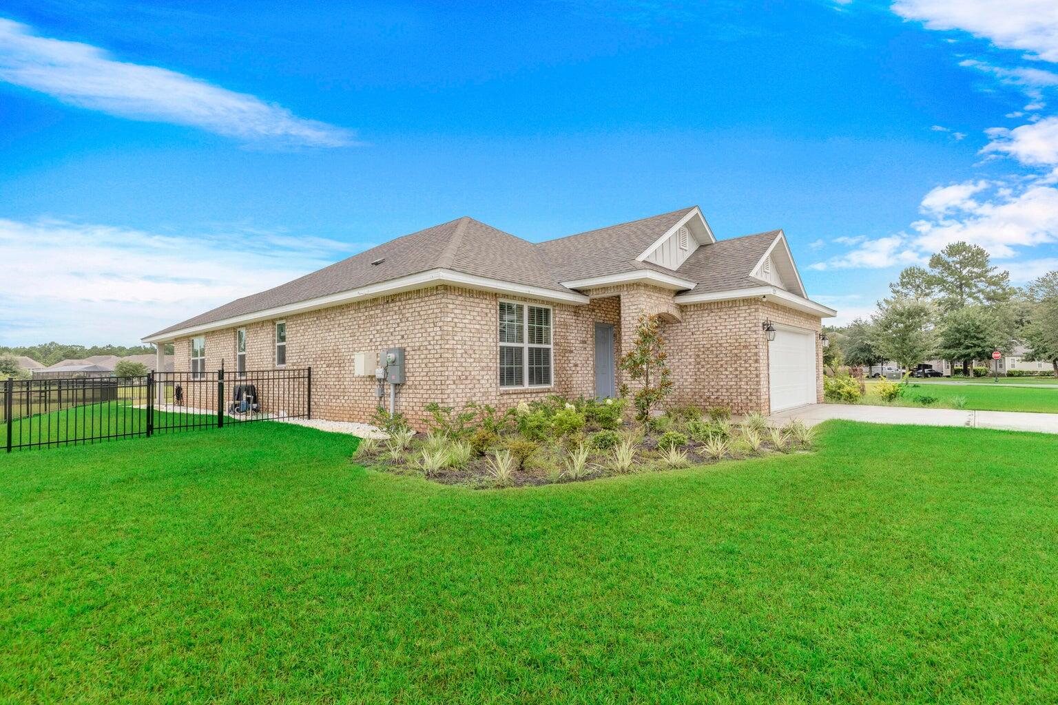 525 Windchime Way Freeport, FL 32439 - Photo 2 of 59 a view of a house with backyard