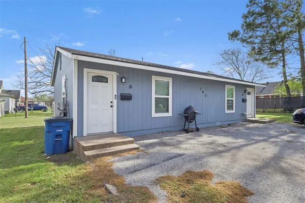 a house view with a backyard space