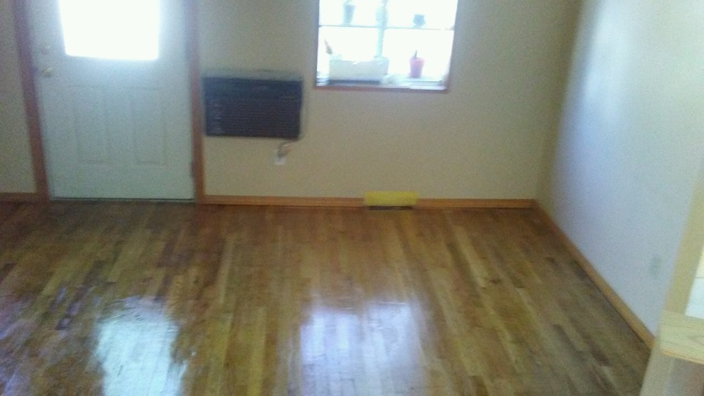 2 Pinckney Street Taunton, MA 02780 - Photo 3 of 5 a view of an empty room with wooden floor and a window