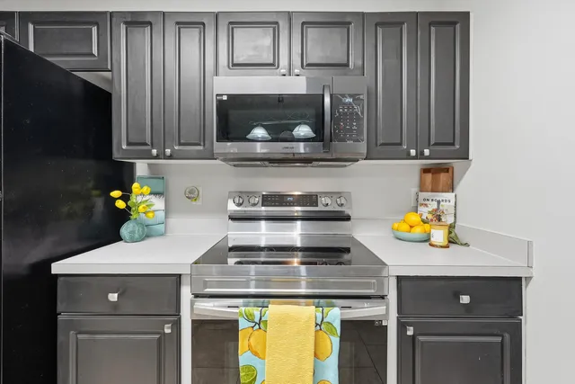 a kitchen with a stove and a microwave