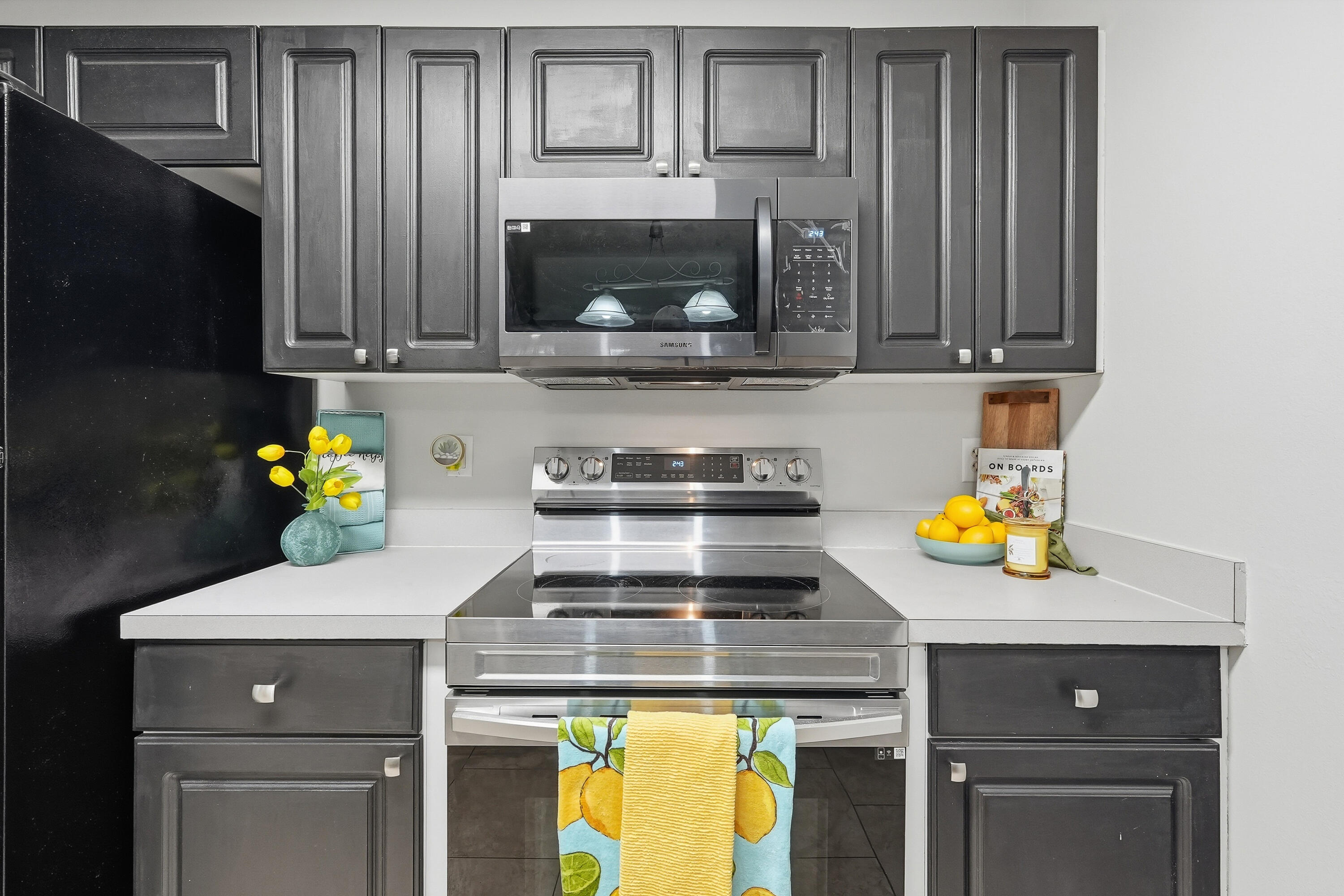 481 Keystone Road Mary Esther, FL 32569 - Photo 11 of 35 a kitchen with a stove and a microwave