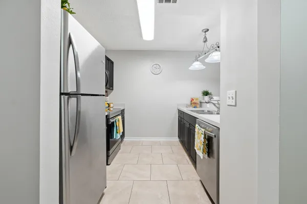 a hallway with a washer dryer and washer
