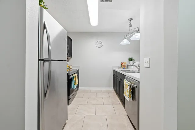a hallway with a washer dryer and washer