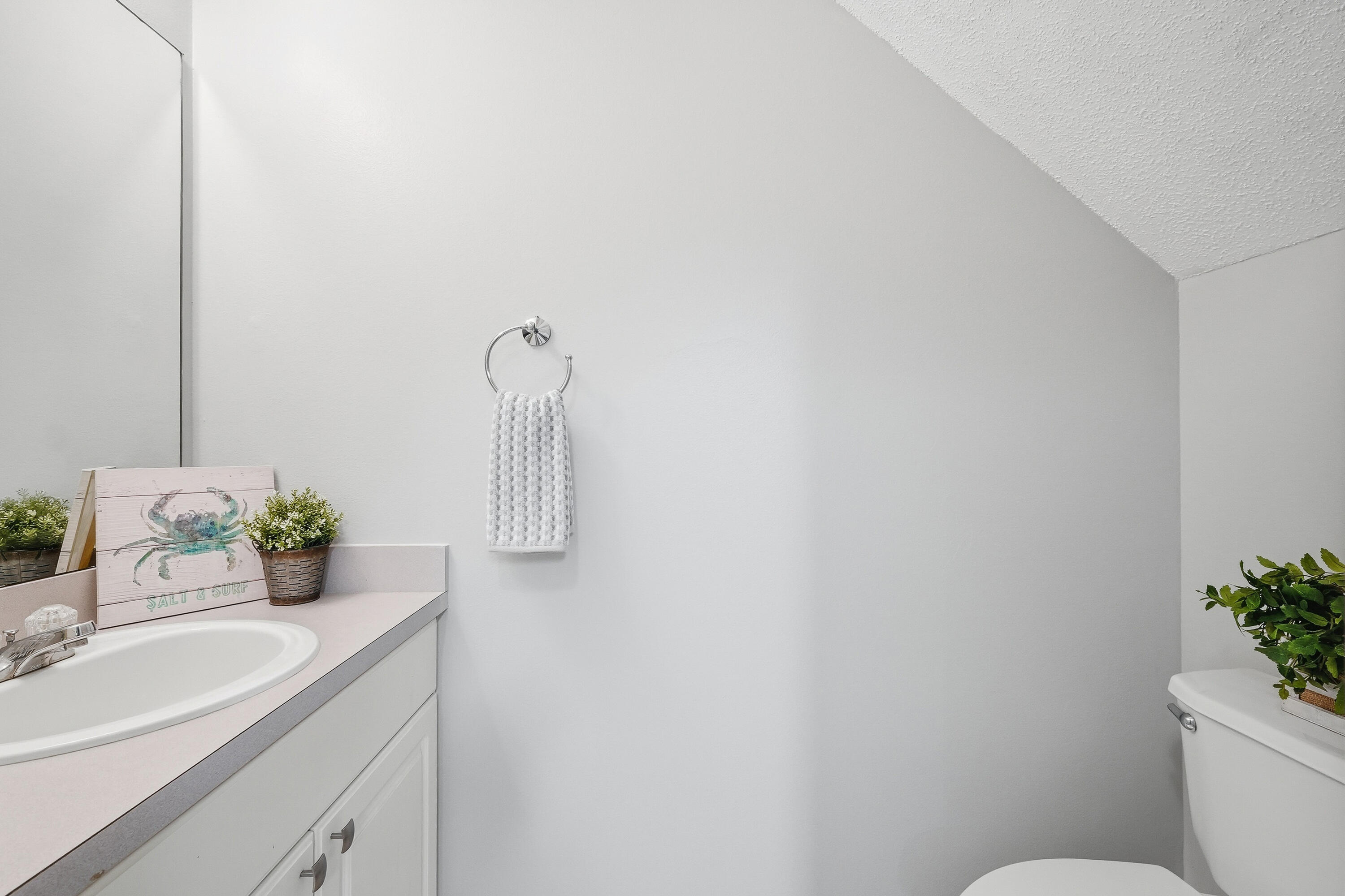 481 Keystone Road Mary Esther, FL 32569 - Photo 16 of 35 a bathroom with a sink toilet and mirror