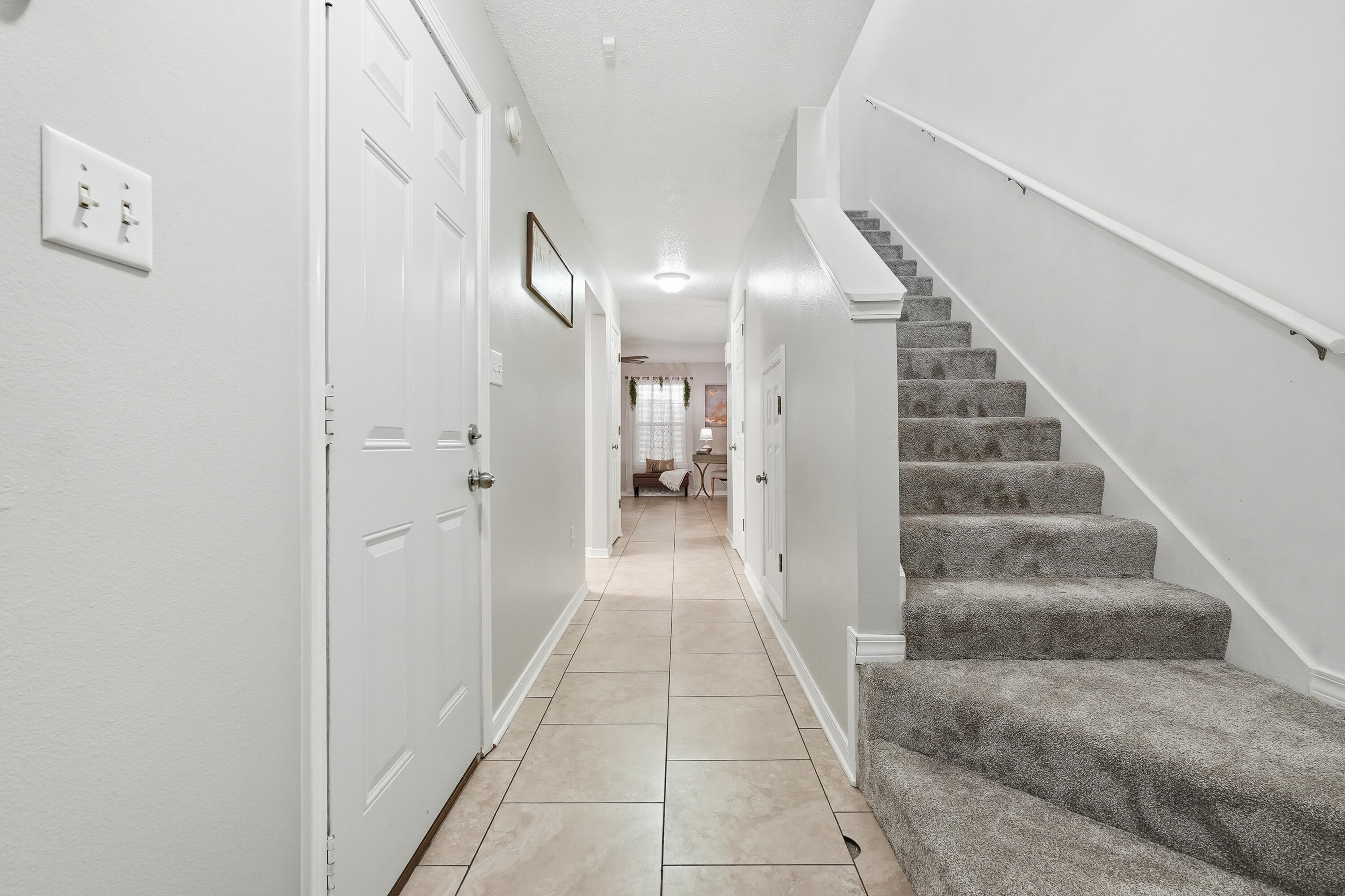 481 Keystone Road Mary Esther, FL 32569 - Photo 18 of 35 a view of a hallway with white walls and a window