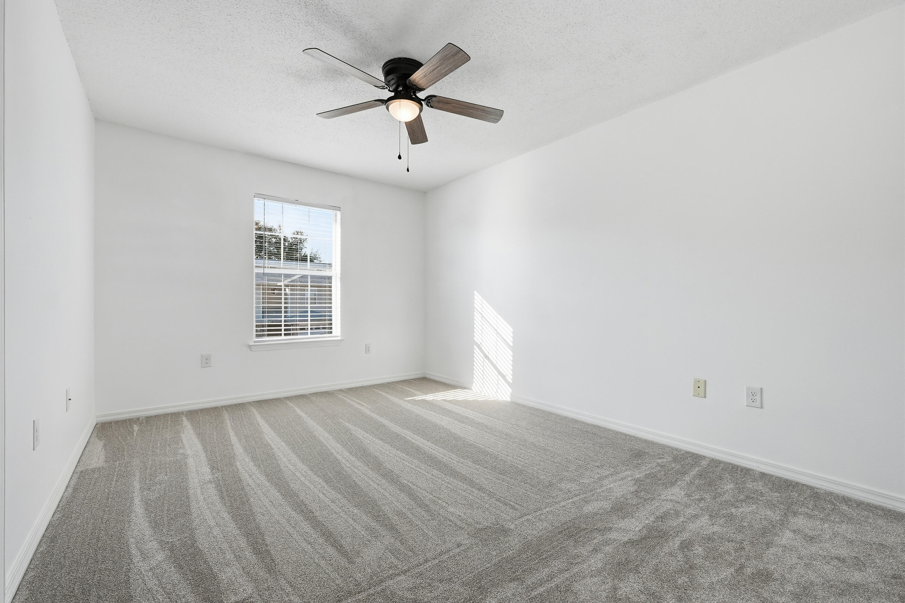 481 Keystone Road Mary Esther, FL 32569 - Photo 25 of 35 wooden floor in an empty room with a window