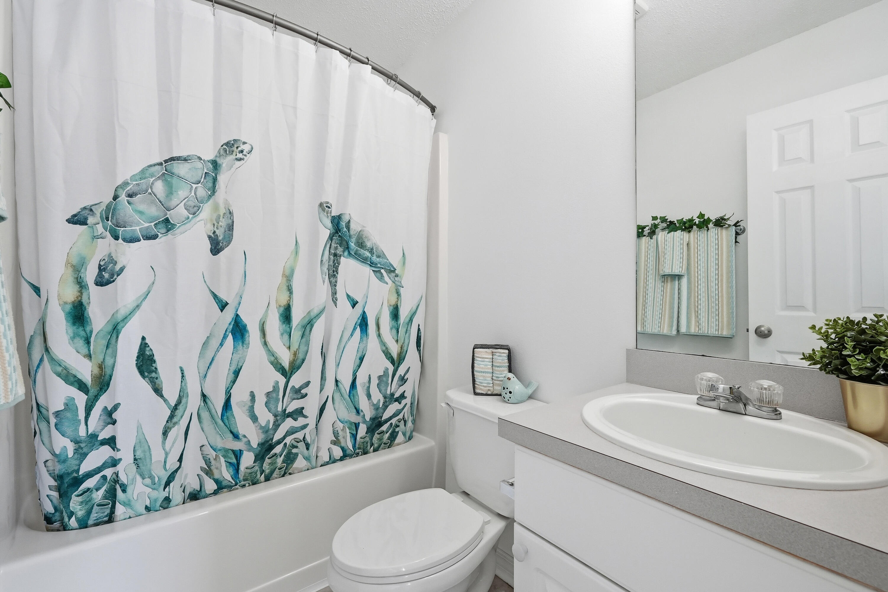 481 Keystone Road Mary Esther, FL 32569 - Photo 29 of 35 a bathroom with a toilet sink and mirror