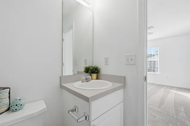 a view of a house with wooden fence