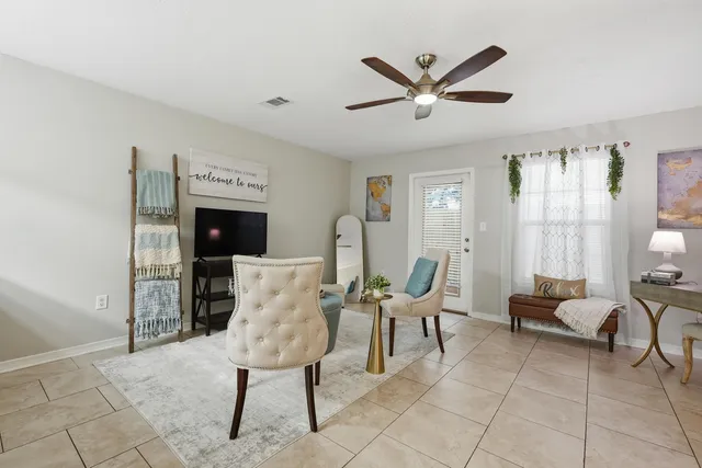a work room with furniture and windows