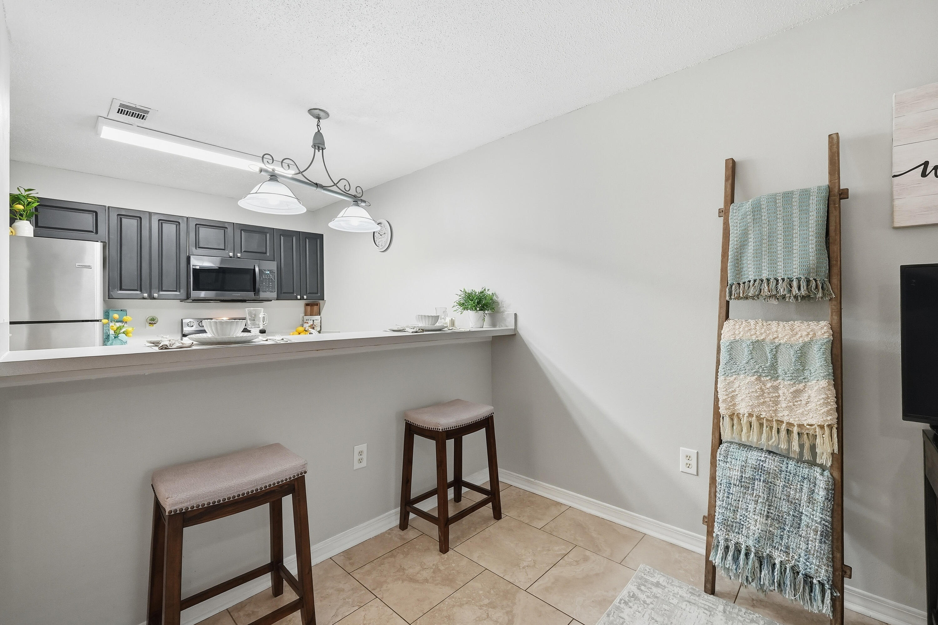 481 Keystone Road Mary Esther, FL 32569 - Photo 8 of 35 a kitchen with kitchen island stainless steel appliances a sink and cabinets