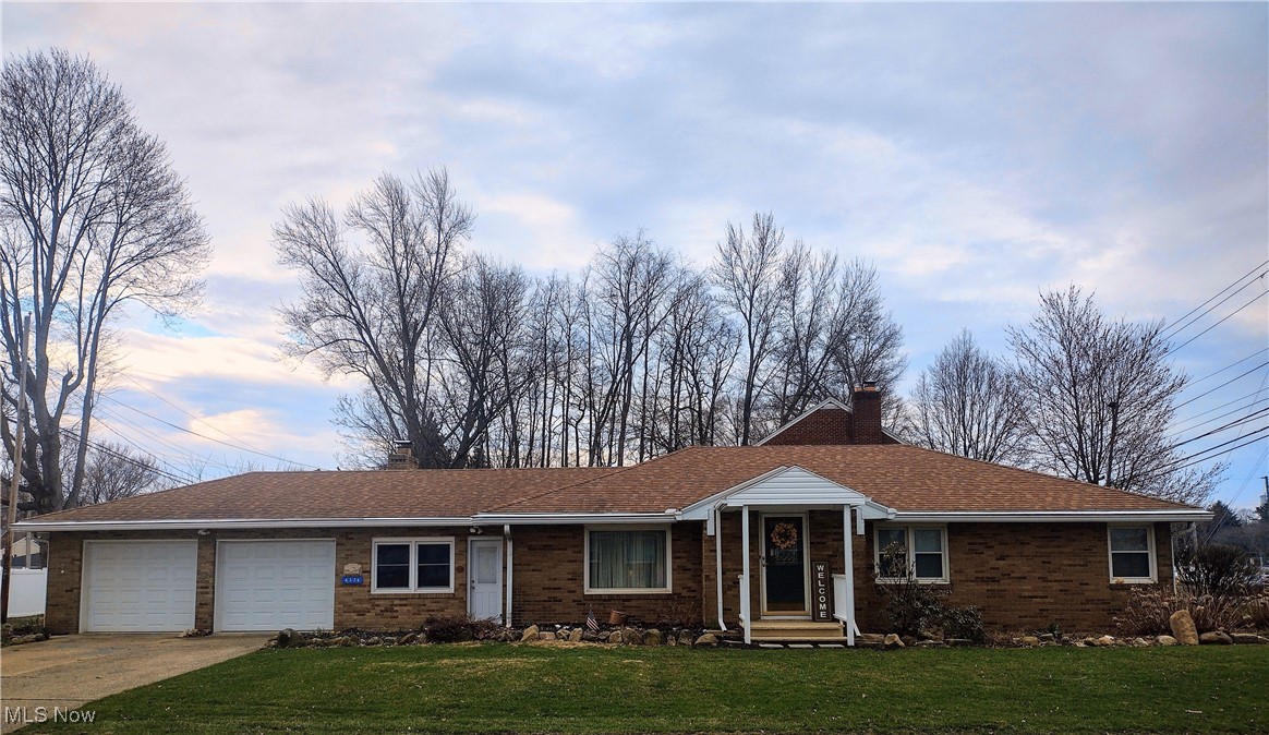 4376 22nd Street Northwest Canton, OH 44708 - Photo 1 of 10 Ranch-style home with a chimney, a front yard, a garage, and driveway