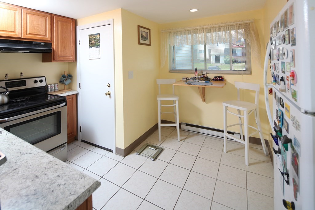 2 Tideview Path, Unit 9 Plymouth, MA 02360 - Photo 2 of 9 a view of kitchen with furniture and window