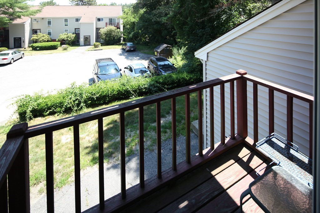 2 Tideview Path, Unit 9 Plymouth, MA 02360 - Photo 9 of 9 a view of a balcony with wooden floor