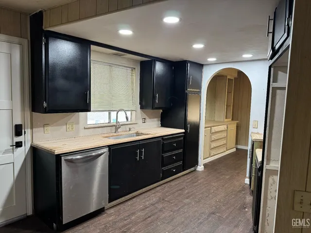 a bathroom with a double vanity sink and a large mirror