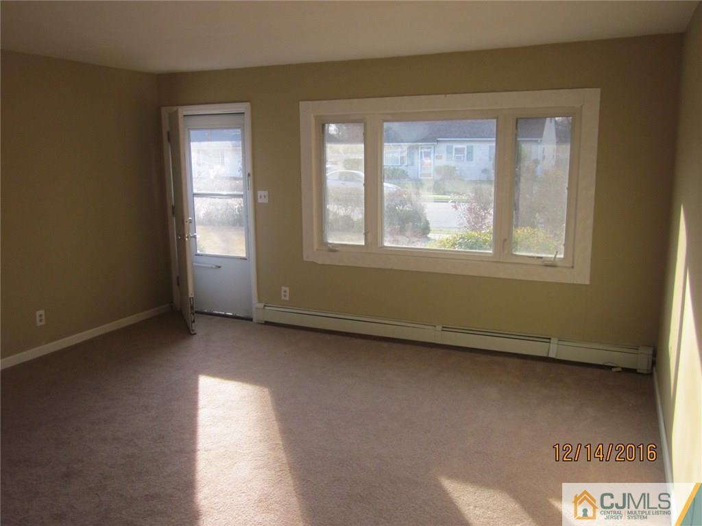 26 Dobson Road Edison, NJ 08817 - Photo 3 of 7 an empty room with a window