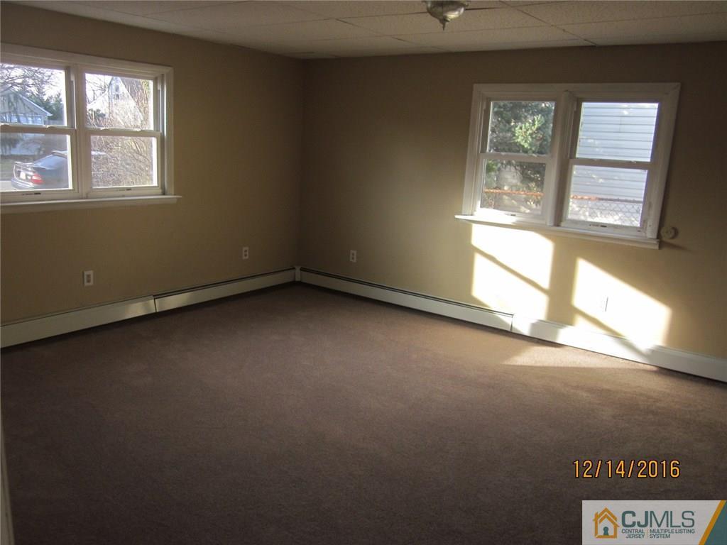 26 Dobson Road Edison, NJ 08817 - Photo 5 of 7 an empty room with a window