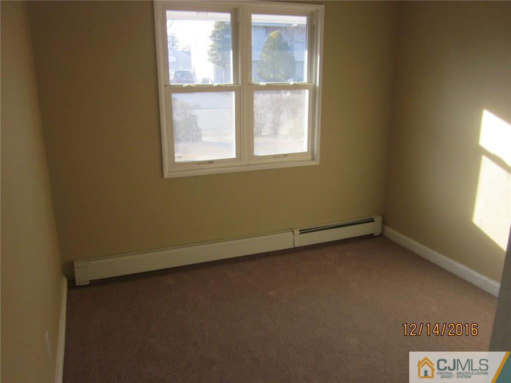 26 Dobson Road Edison, NJ 08817 - Photo 6 of 7 an empty room with a window