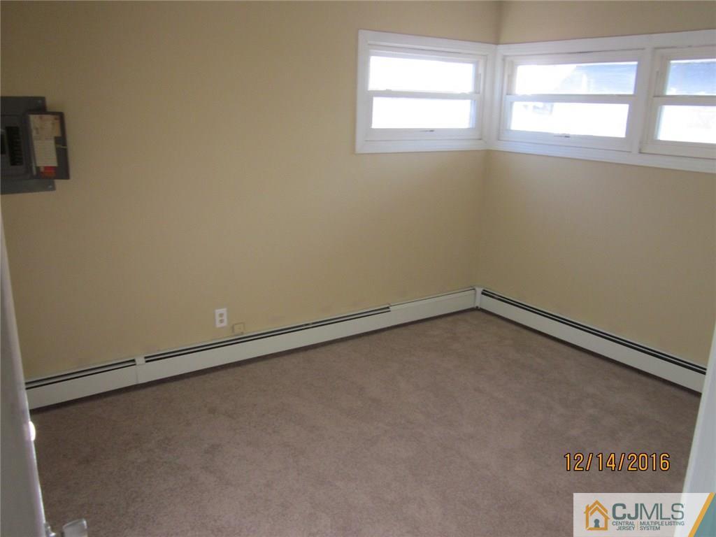 26 Dobson Road Edison, NJ 08817 - Photo 7 of 7 an empty room with a window