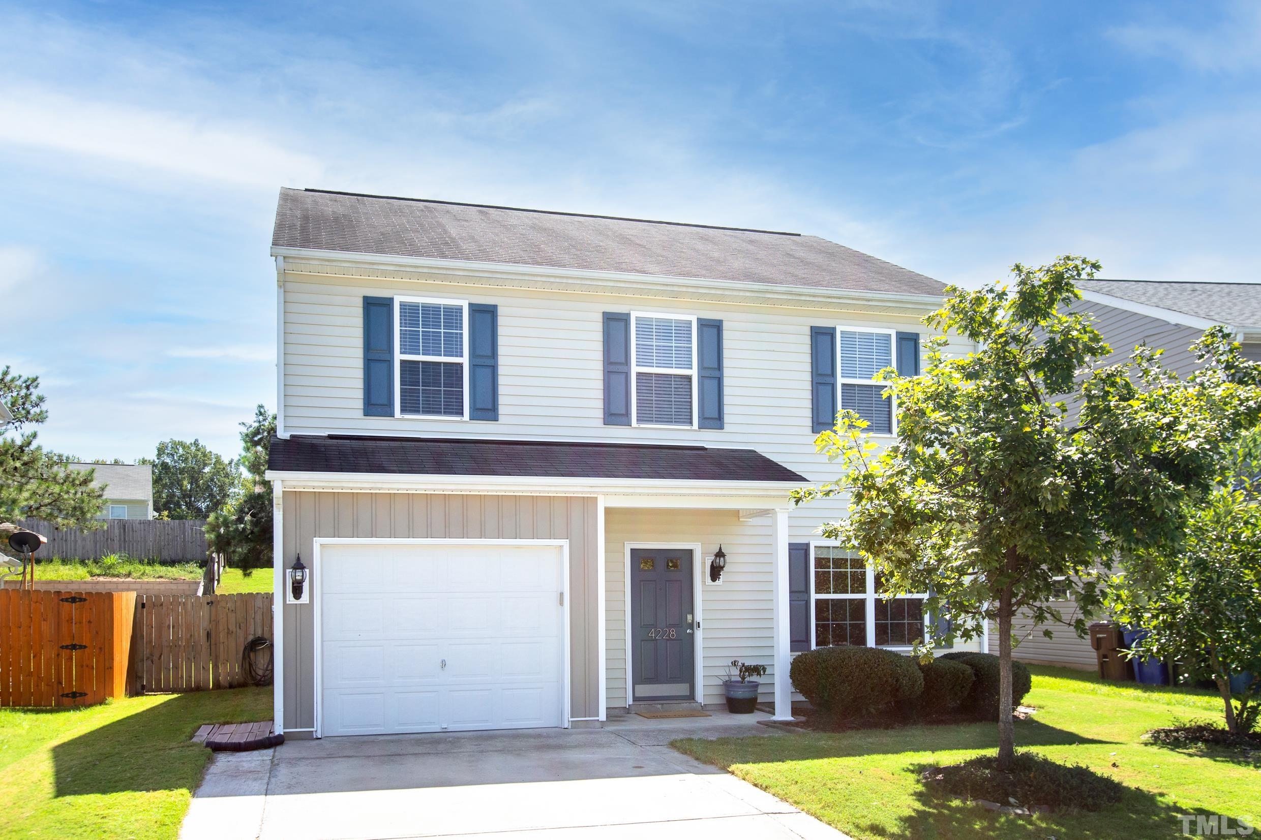 a view of a house with backyard and swimming pool