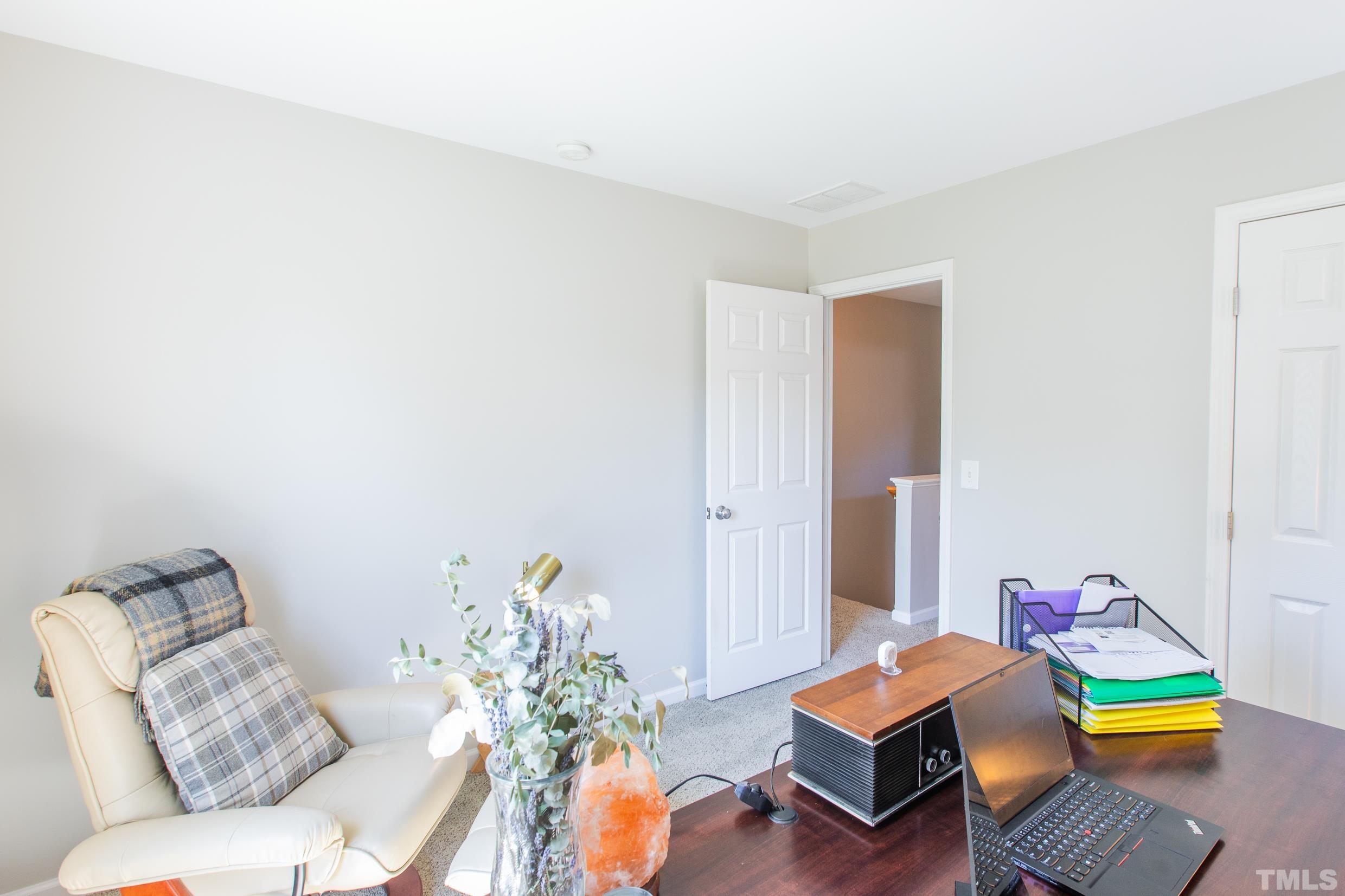 4228 Amber Stone Way Durham, NC 27704 - Photo 18 of 34 a living room with furniture and wooden floor