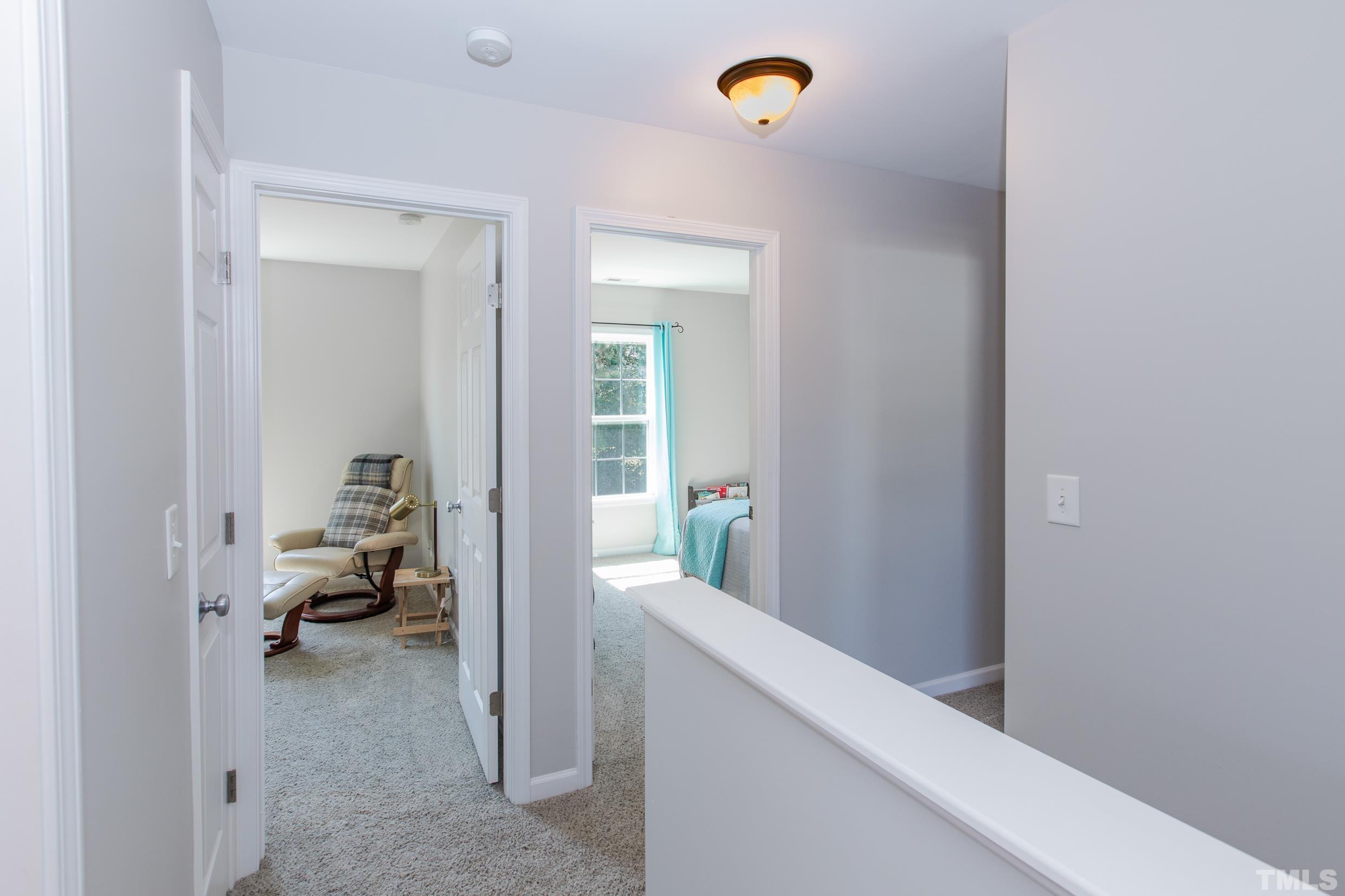 4228 Amber Stone Way Durham, NC 27704 - Photo 20 of 34 a view of hallway with livingroom and bedroom