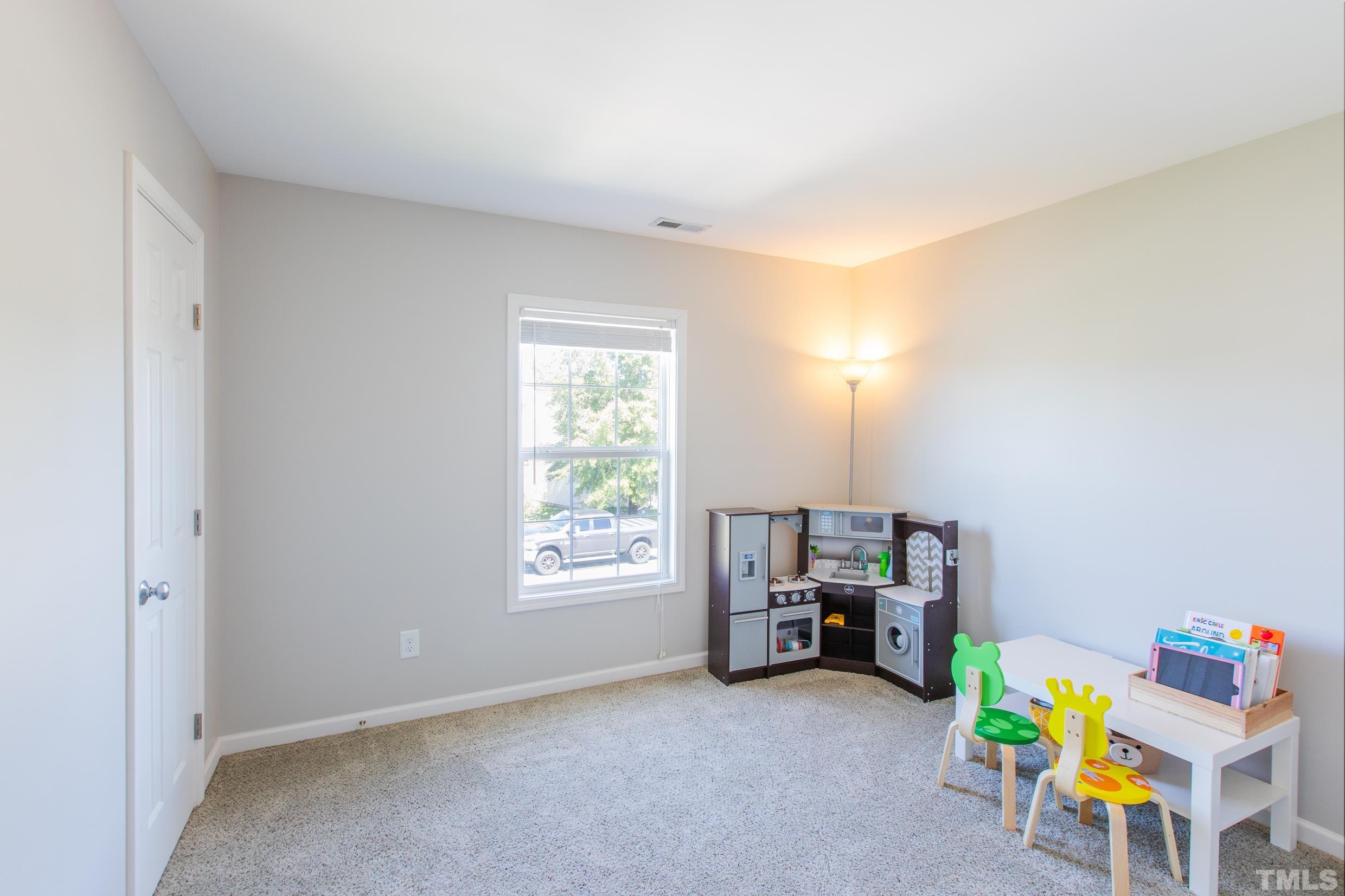 4228 Amber Stone Way Durham, NC 27704 - Photo 24 of 34 a view of a room with toys and a window