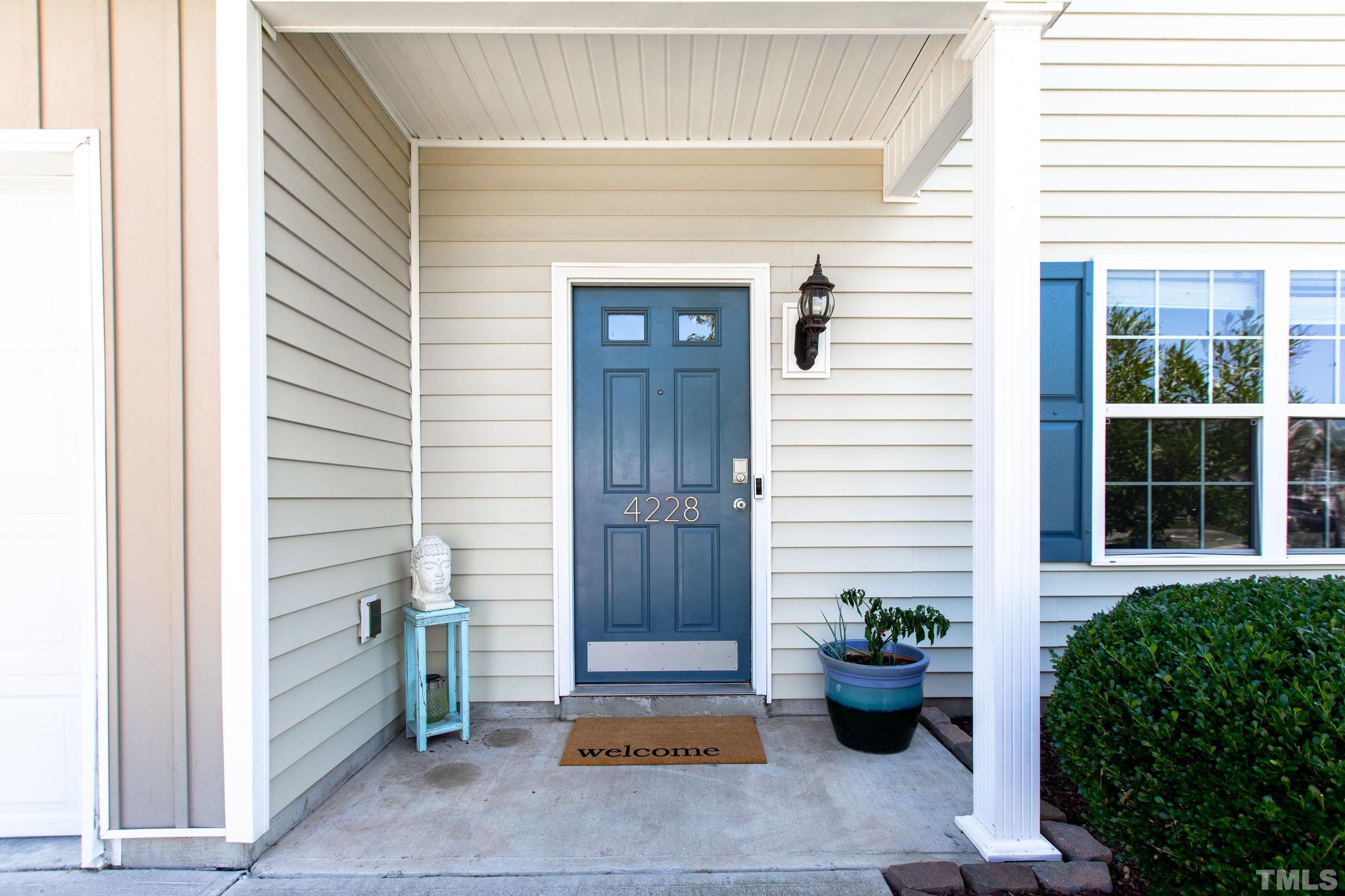 4228 Amber Stone Way Durham, NC 27704 - Photo 3 of 34 a view of a entryway door front of the house