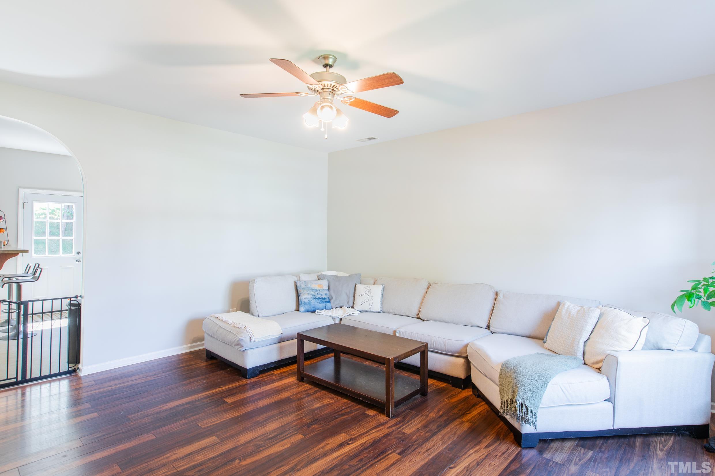 4228 Amber Stone Way Durham, NC 27704 - Photo 6 of 34 a living room with furniture and wooden floor
