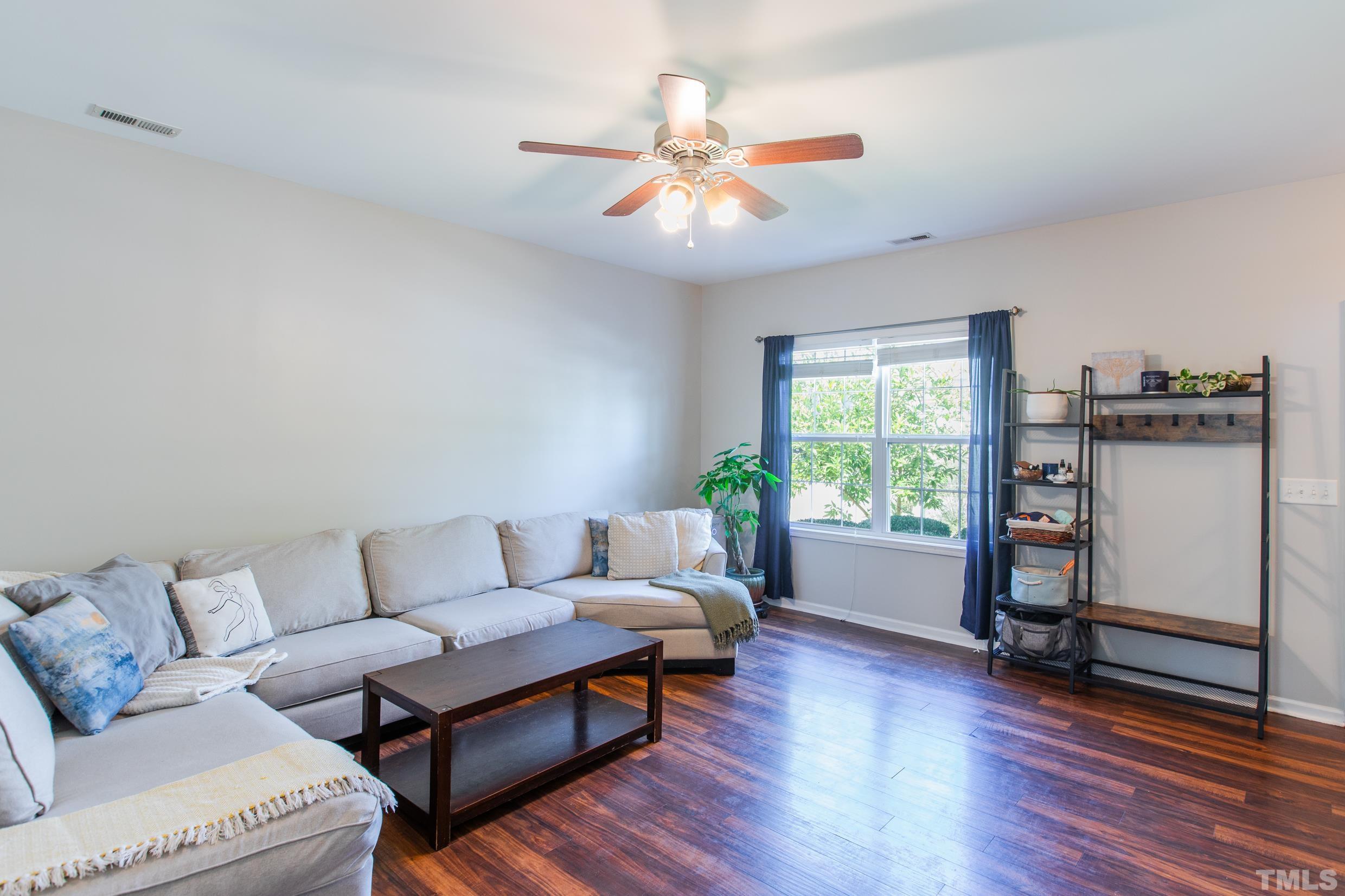 4228 Amber Stone Way Durham, NC 27704 - Photo 7 of 34 a living room with furniture and a window