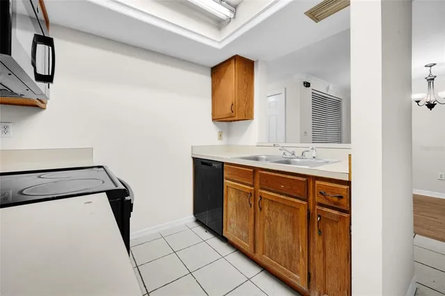 a bathroom with a granite countertop sink a mirror and vanity