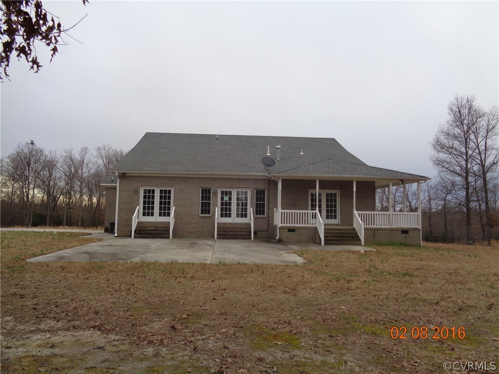 20172 Horseshoe Road Carson, VA 23830 - Photo 3 of 27 a front view of a house with a yard and trees
