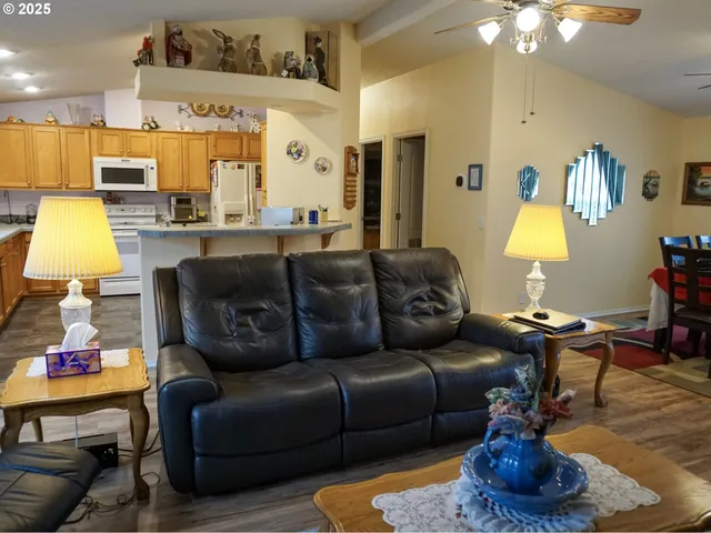 a living room with furniture and a lamp