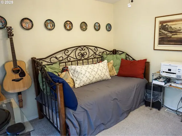 a bedroom with a bed and a table