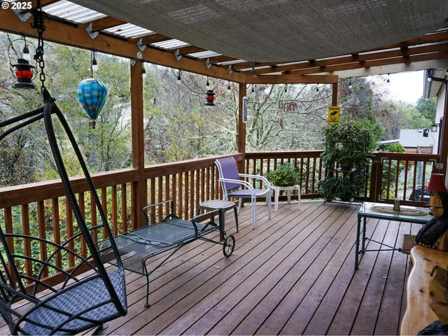 a view of a balcony with wooden floor