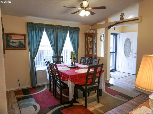 a view of a dining room with furniture and window