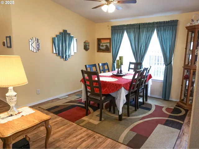 a dining room with furniture and window