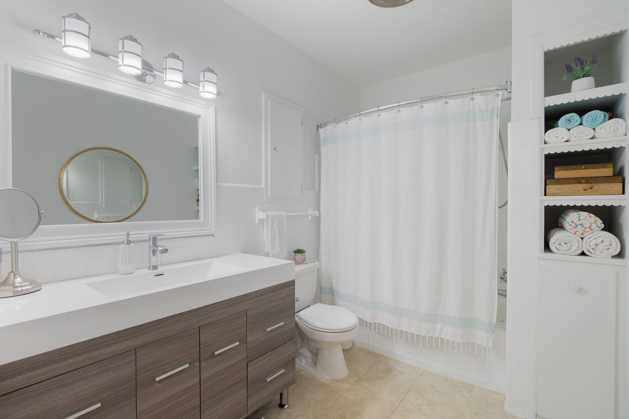 651 Ocean Inlet Drive Boynton Beach, FL 33435 - Photo 17 of 44 a bathroom with a toilet sink a mirror and shower