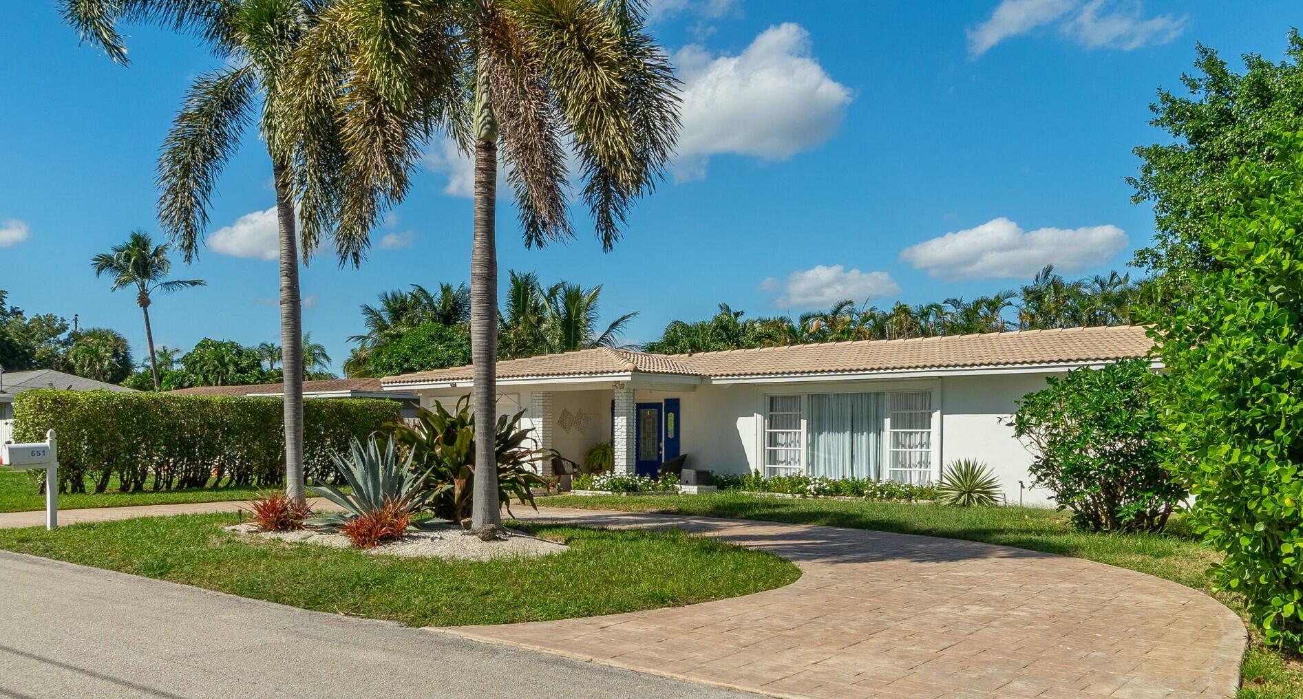 651 Ocean Inlet Drive Boynton Beach, FL 33435 - Photo 2 of 44 a view of a house with a yard and potted plants