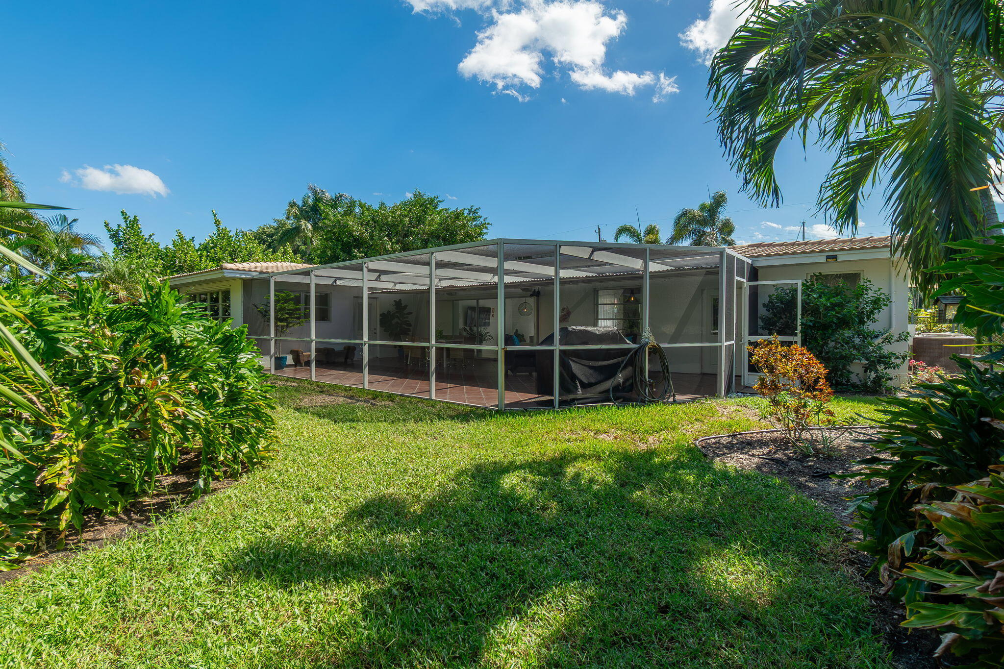651 Ocean Inlet Drive Boynton Beach, FL 33435 - Photo 28 of 44 a view of a house with backyard and garden
