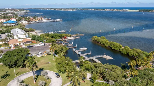 an aerial view of a house with a lake view
