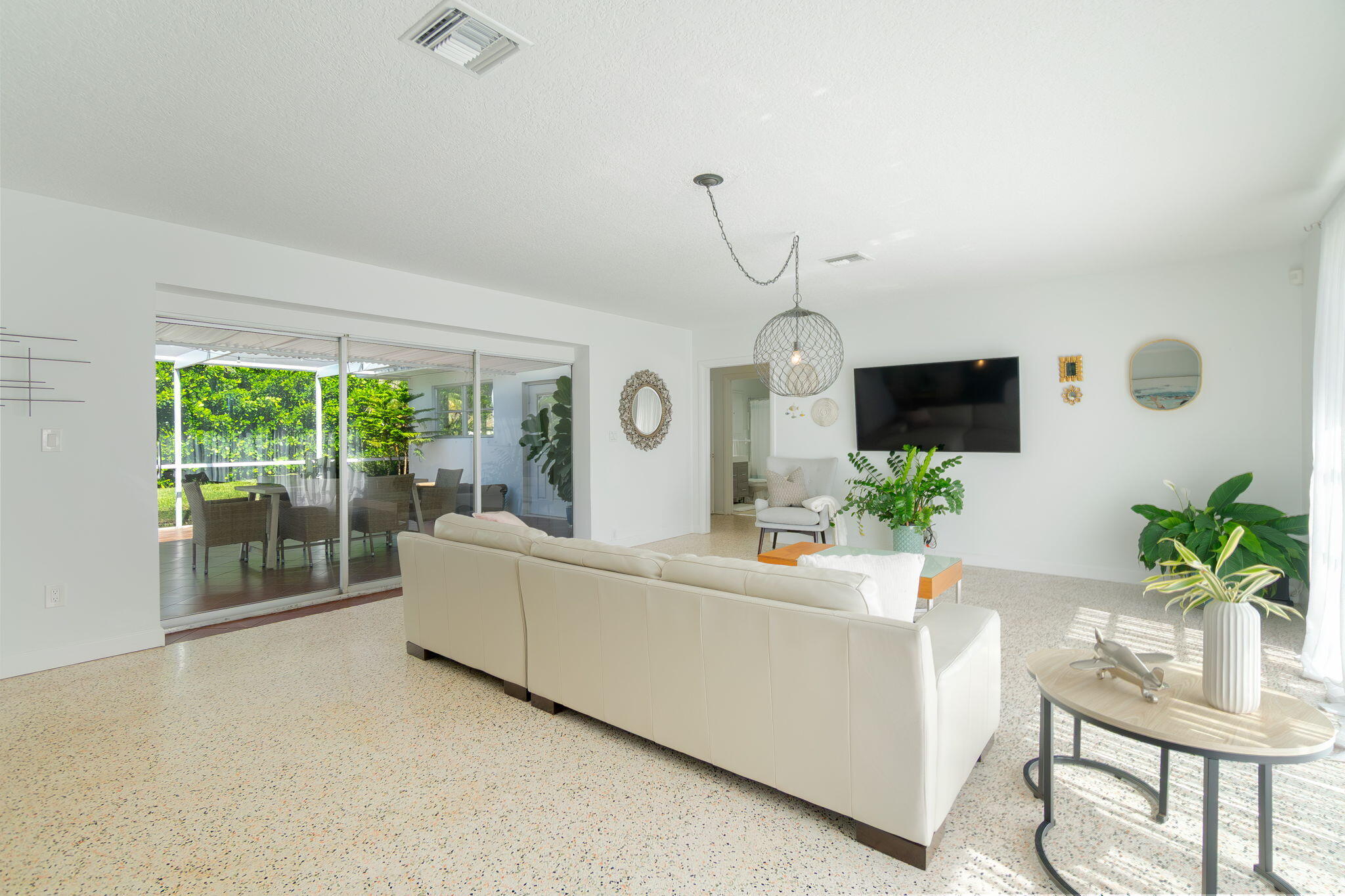 651 Ocean Inlet Drive Boynton Beach, FL 33435 - Photo 6 of 44 a living room with furniture and a flat screen tv