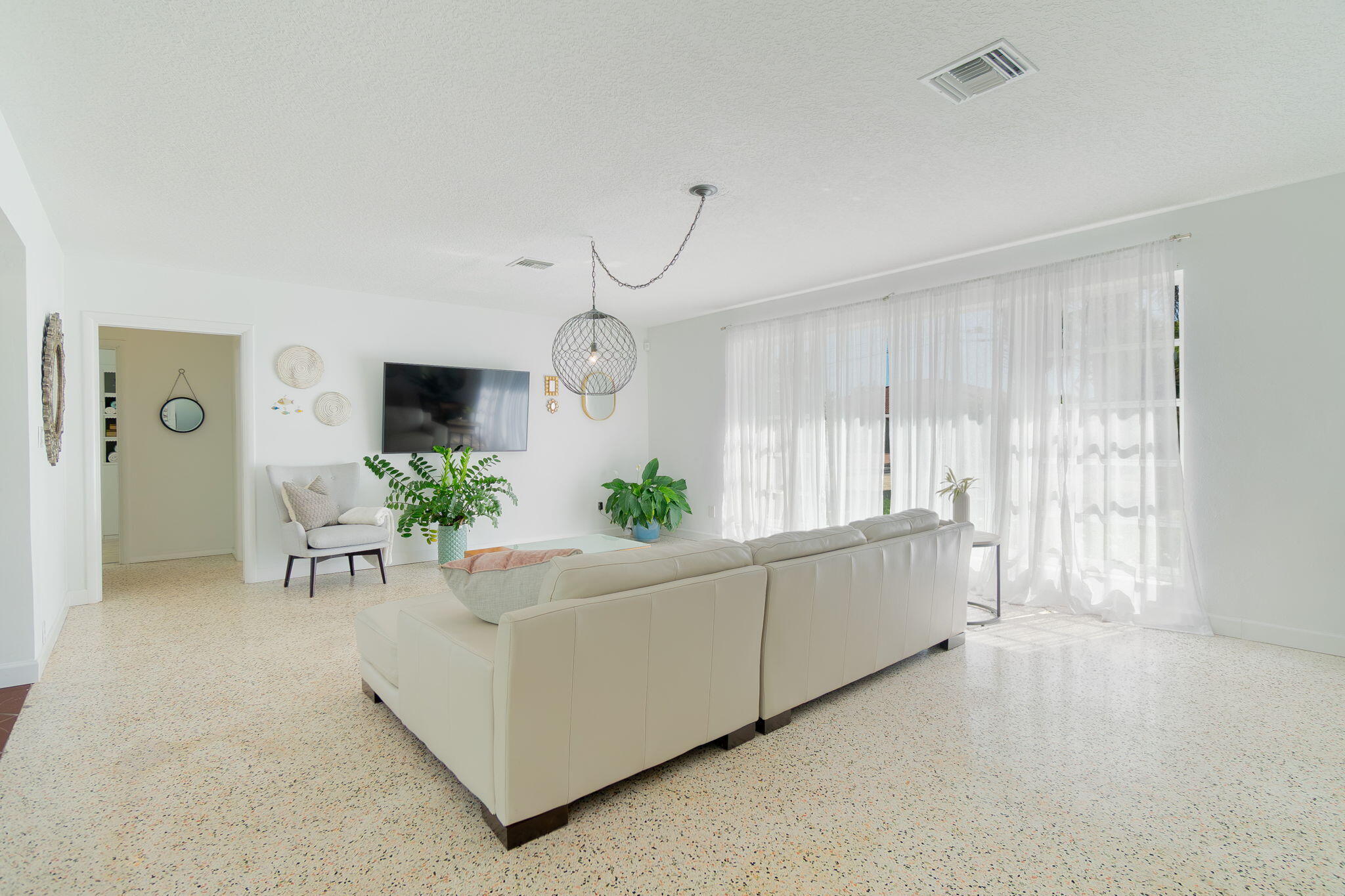 651 Ocean Inlet Drive Boynton Beach, FL 33435 - Photo 7 of 44 a living room with furniture and potted plants