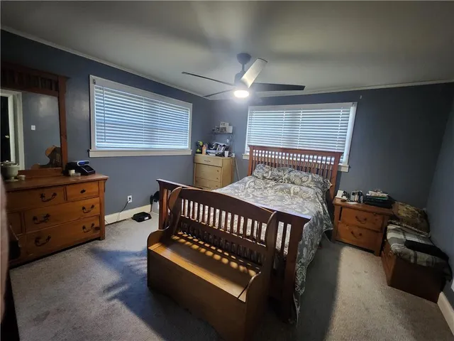 a bedroom with furniture and a window