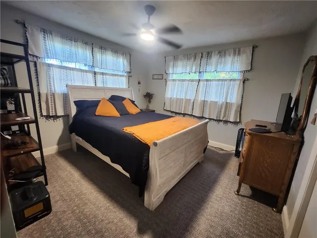 a bed room with a bed and a window