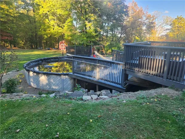 a view of a chair and table in the garden