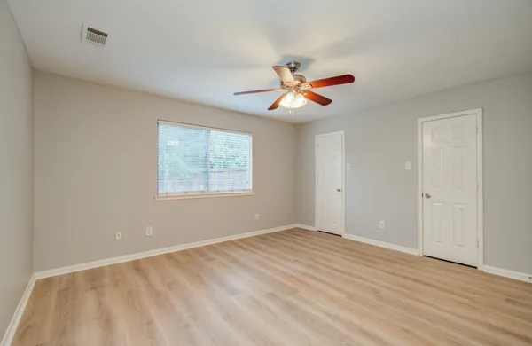 a view of an empty room with a window
